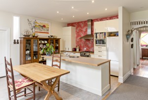 Client's own dining table by Harvey Designs circa 1974, formica bench with rimu clashing works well with the villa setting.